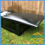 Black Jeep LJ hard top.